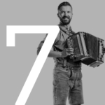 #7 German man wearing lederhosen and playing an acordian
